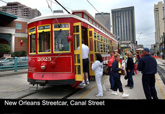 People boarding a vibrant streetcar on Canal street, New Orleans